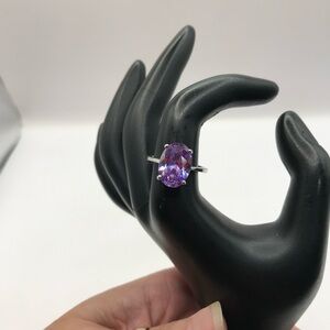 Silver-tone with a lilac faceted glass gem fashion ring